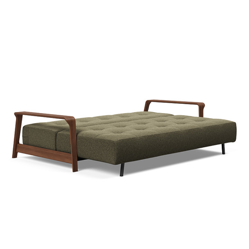 The Ran D.E.L Sofa Bed from Innovation Living with boucle forest green 535 upholstery setup as a bed.