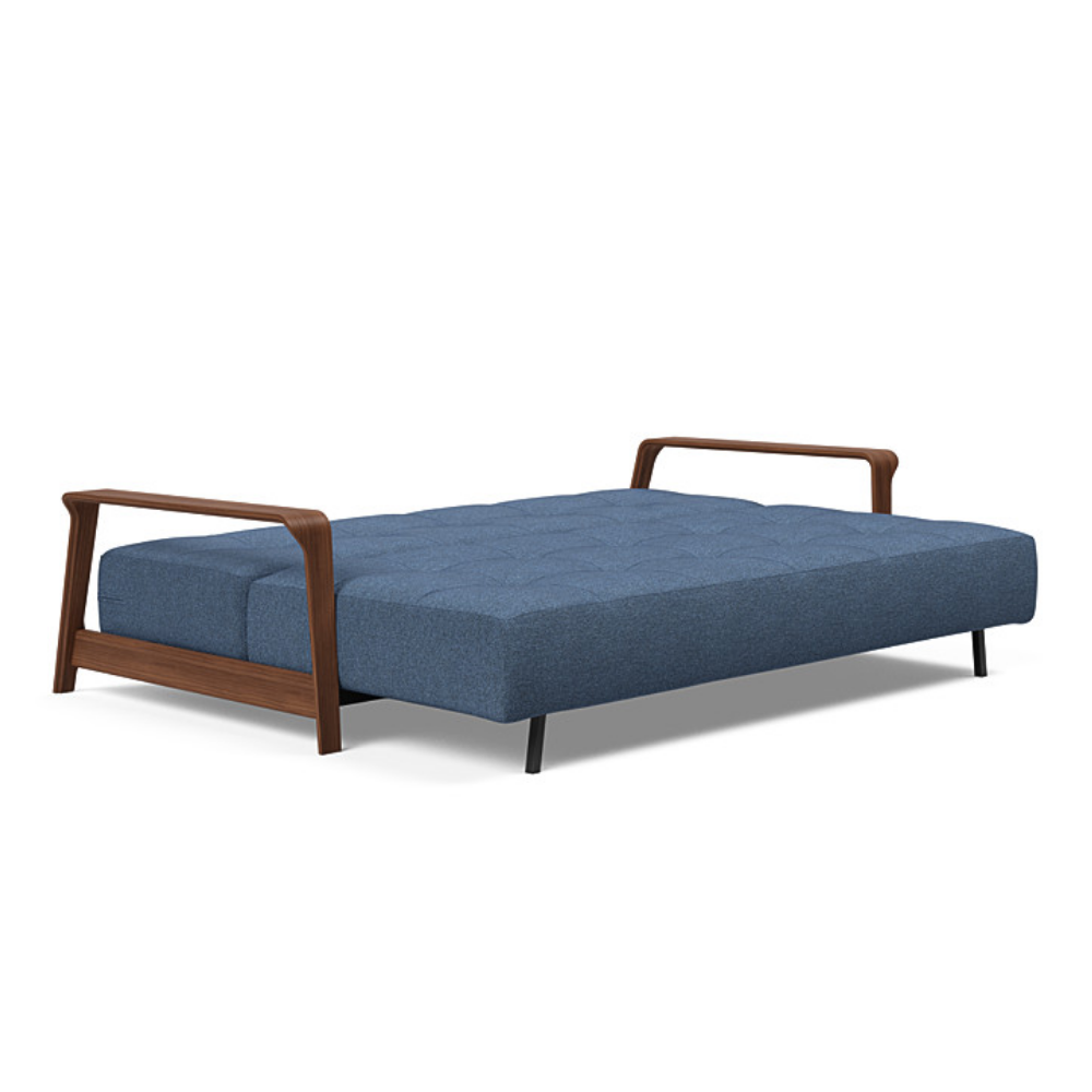 The Ran D.E.L Sofa Bed from Innovation Living with weda blue 302 upholstery setup as a bed.