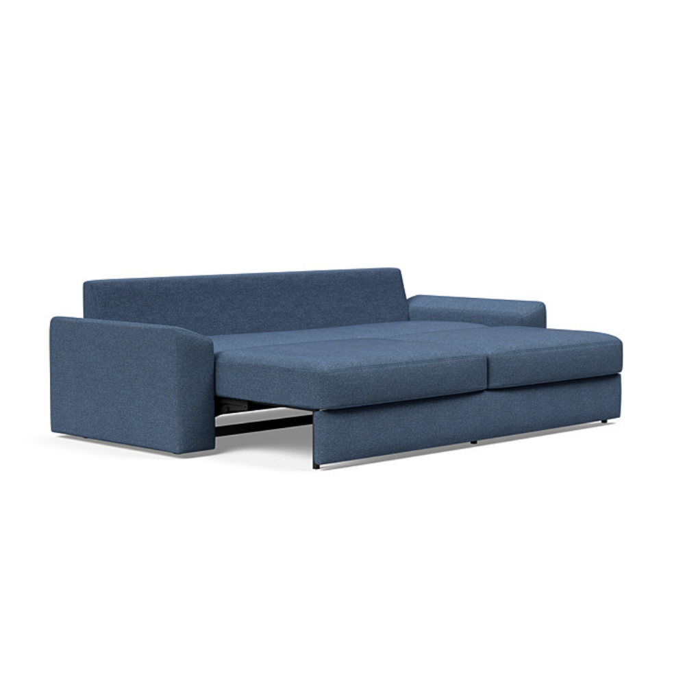 The Vilander Sleeper Sofa With Cushion Arms from Innovation Living with weda blue 302 upholstery setup as a bed.