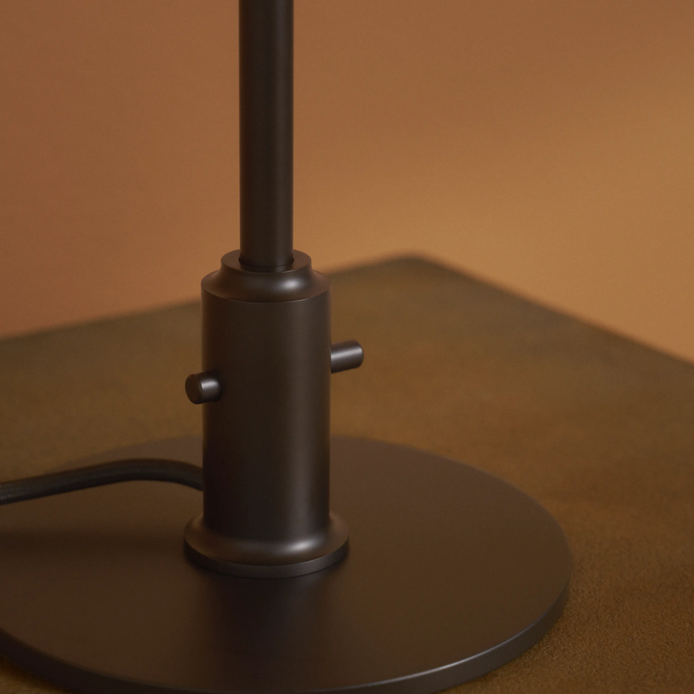 Through switch on/off controls of the PH 3/2 Table Lamp Centenary Edition by Louis Poulsen.