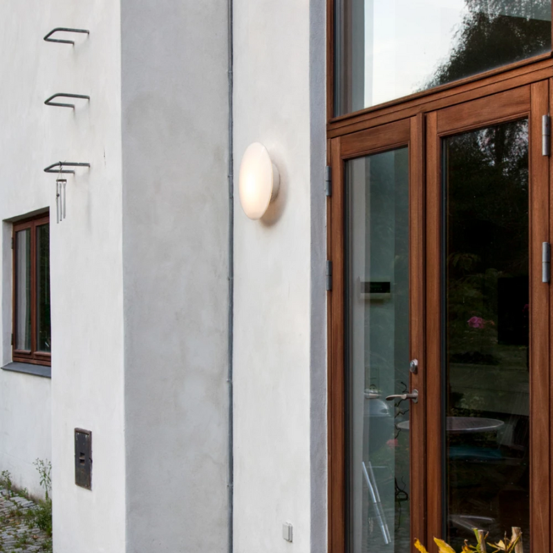 The AJ Eklipta Outdoor from Louis Poulsen outside a home. all-groups