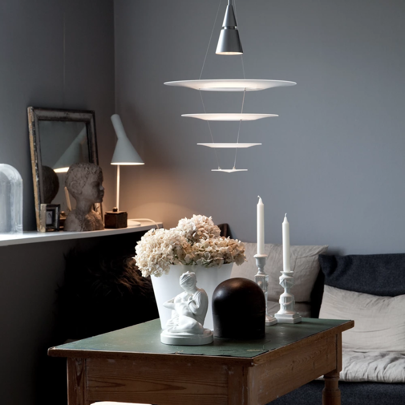 The Enigma 425 from Louis Poulsen in brushed aluminum in a lounge.