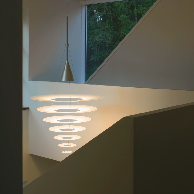 The Enigma 825 from Louis Poulsen in brushed aluminum in a lounge.