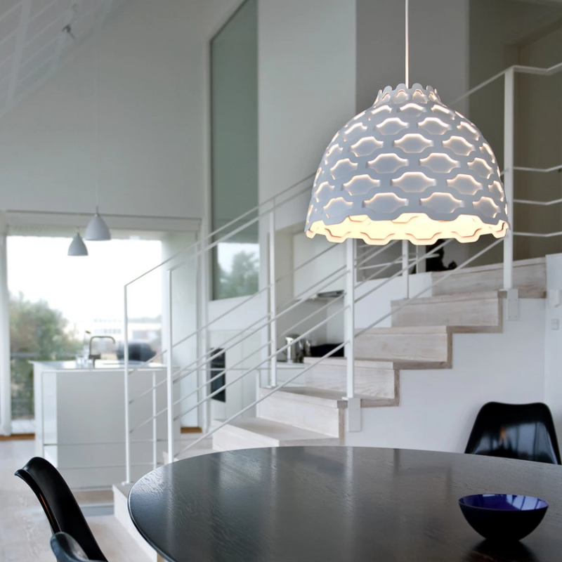 The LC Shutters Pendant from Louis Poulsen in a dining room.