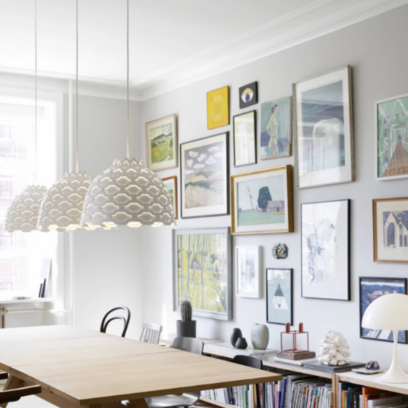 The LC Shutters Pendant from Louis Poulsen in a living room.