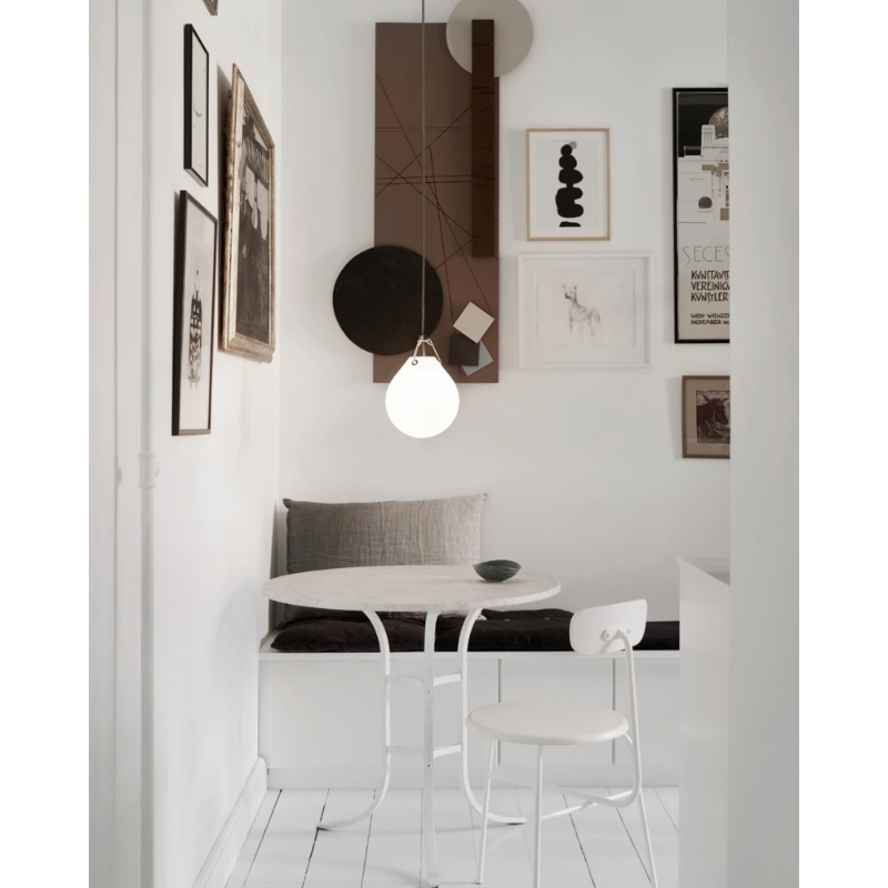 The Moser Pendant from Louis Poulsen in a dining room. all-groups