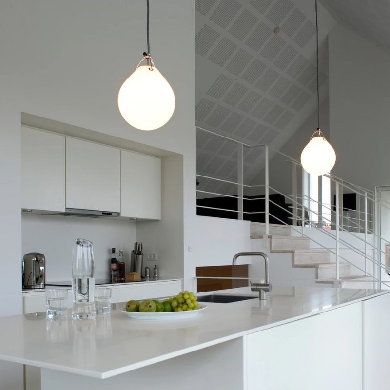 The Moser Pendant from Louis Poulsen in a kitchen and dining setting. all-groups