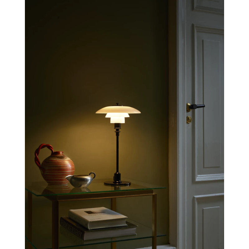 The black PH 2/1 Table Lamp from Louis Poulsen in a living room.