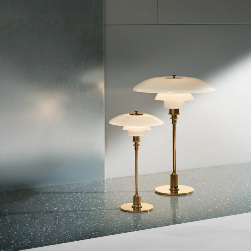 The brass PH 2/1 Table Lamp from Louis Poulsen in a family space.