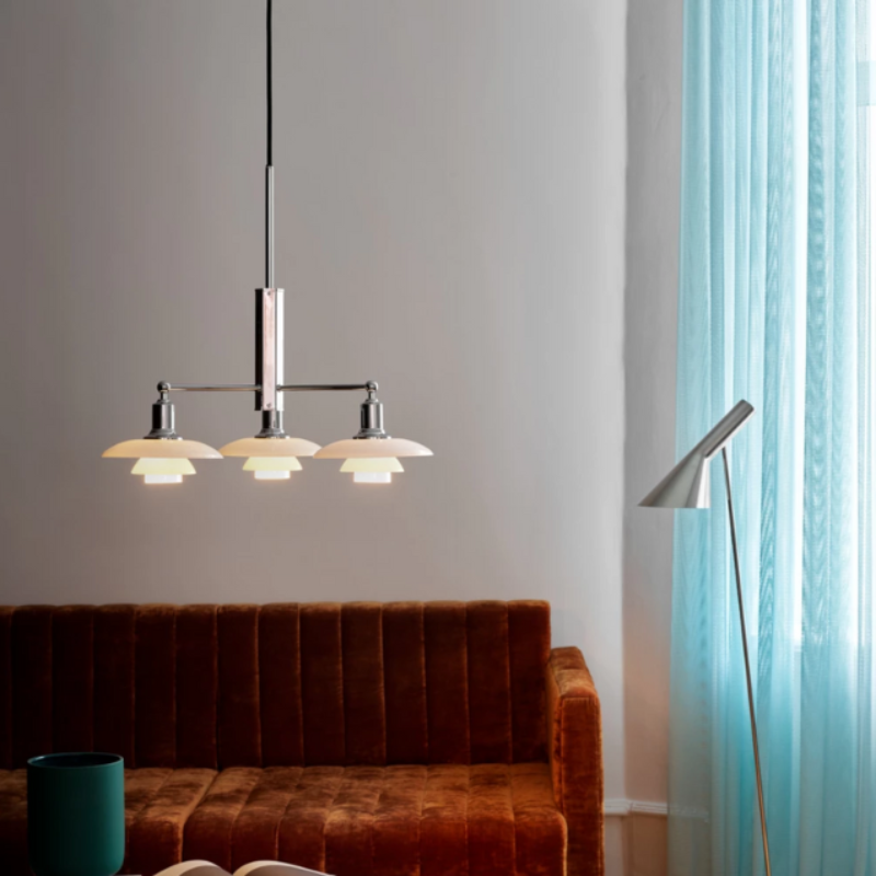 The PH 2/1 Stem Fitting from Louis Poulsen in a living room.