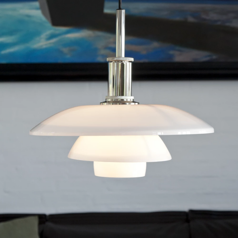 The PH 4½-4 Pendant from Louis Poulsen in a living room.