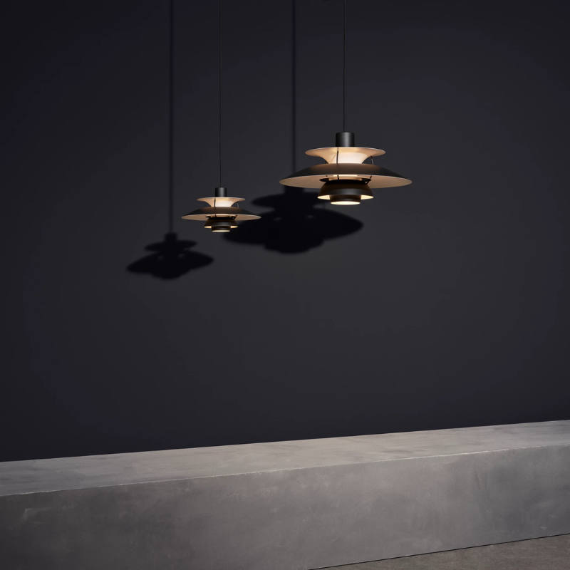 The PH 5 Mini Pendant from Louis Poulsen in monochrome black in a gallery.