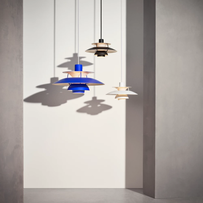 The PH 5 from Louis Poulsen in a lighting collection image with other pendant lights.