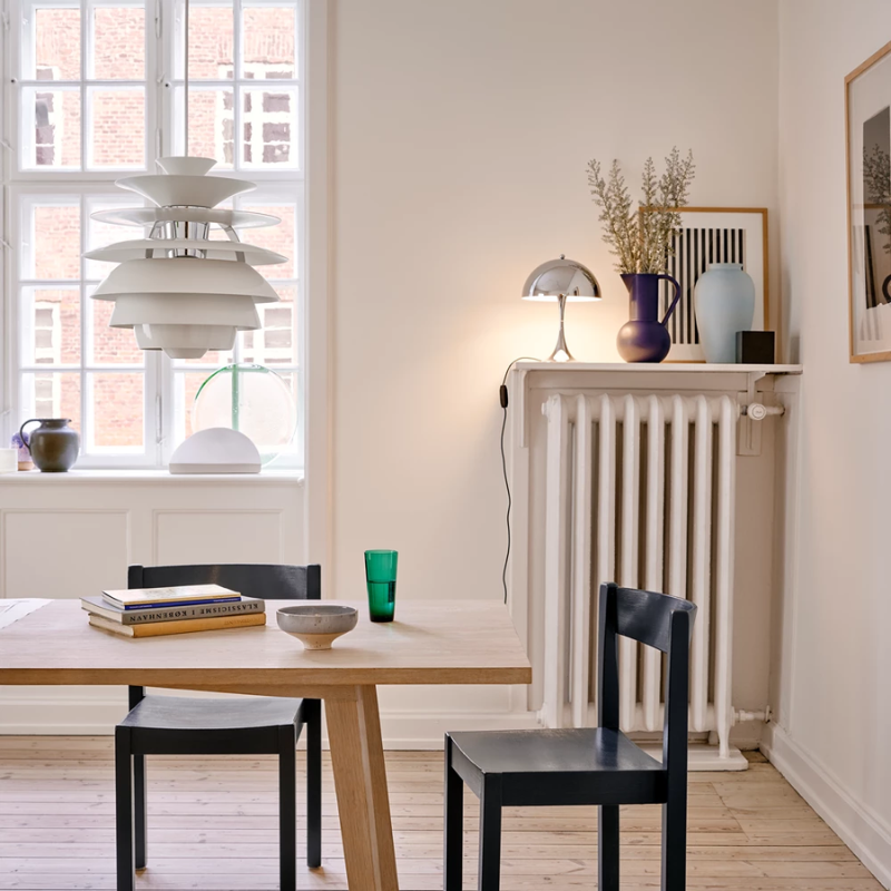 The PH Snowball from Louis Poulsen in a dining room.