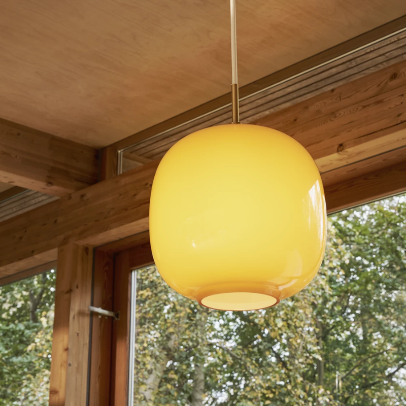 The VL 45 Radiohus Pendant from Louis Poulsen with amber glass close up.