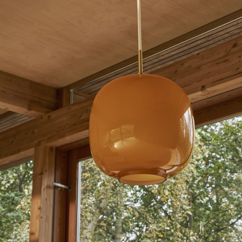 The VL 45 Radiohus Pendant from Louis Poulsen with amber glass in detail.