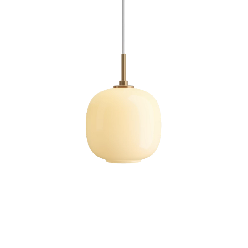 The 6.9 inch VL 45 Radiohus Pendant from Louis Poulsen in pale yellow glass turned on.
