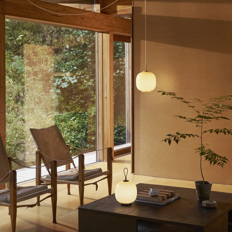 The VL 45 Radiohus Pendant from Louis Poulsen in pale yellow glass in a family area.