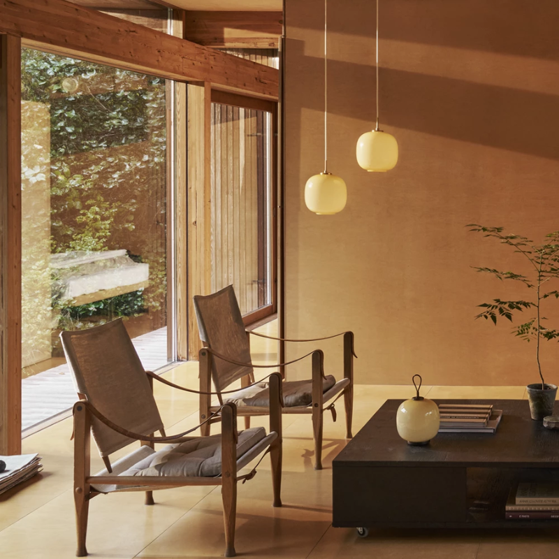 The VL 45 Radiohus Pendant from Louis Poulsen in pale yellow glass in a family room.