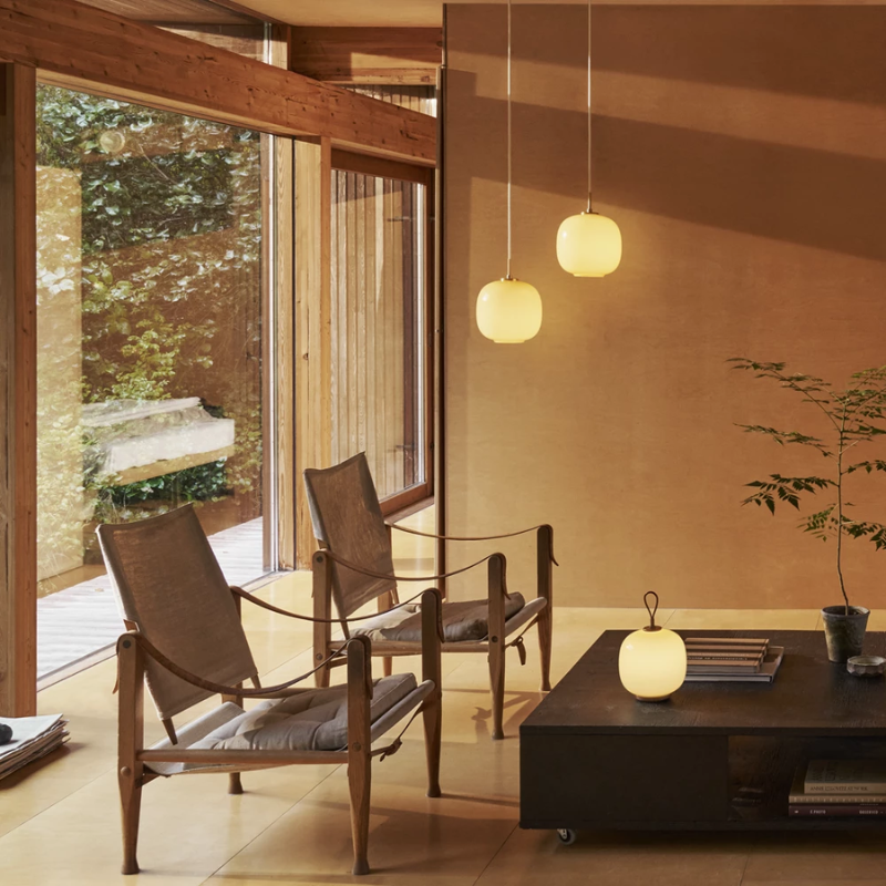 The VL 45 Radiohus Pendant from Louis Poulsen in pale yellow glass in a lounge.