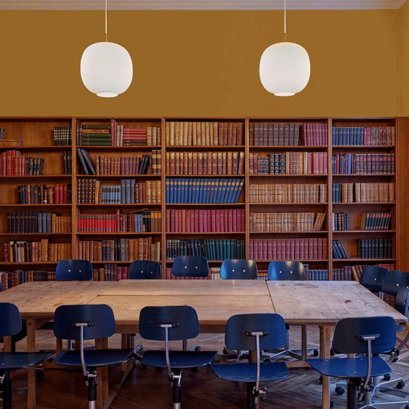 The VL 45 Radiohus Pendant from Louis Poulsen with white opal glass in a business office.