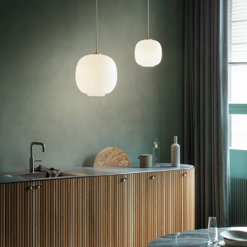 The VL 45 Radiohus Pendant from Louis Poulsen with white opal glass in a kitchen and dining setting.
