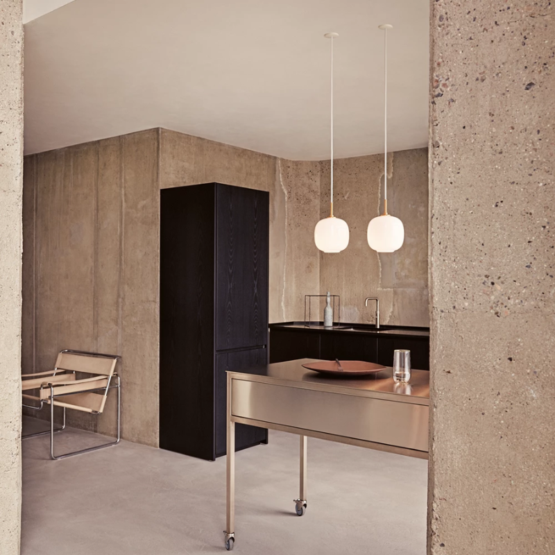 The VL 45 Radiohus Pendant from Louis Poulsen with white opal glass in a kitchen.