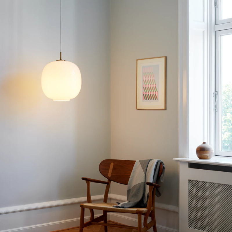 The VL 45 Radiohus Pendant from Louis Poulsen with white opal glass above a reading nook.