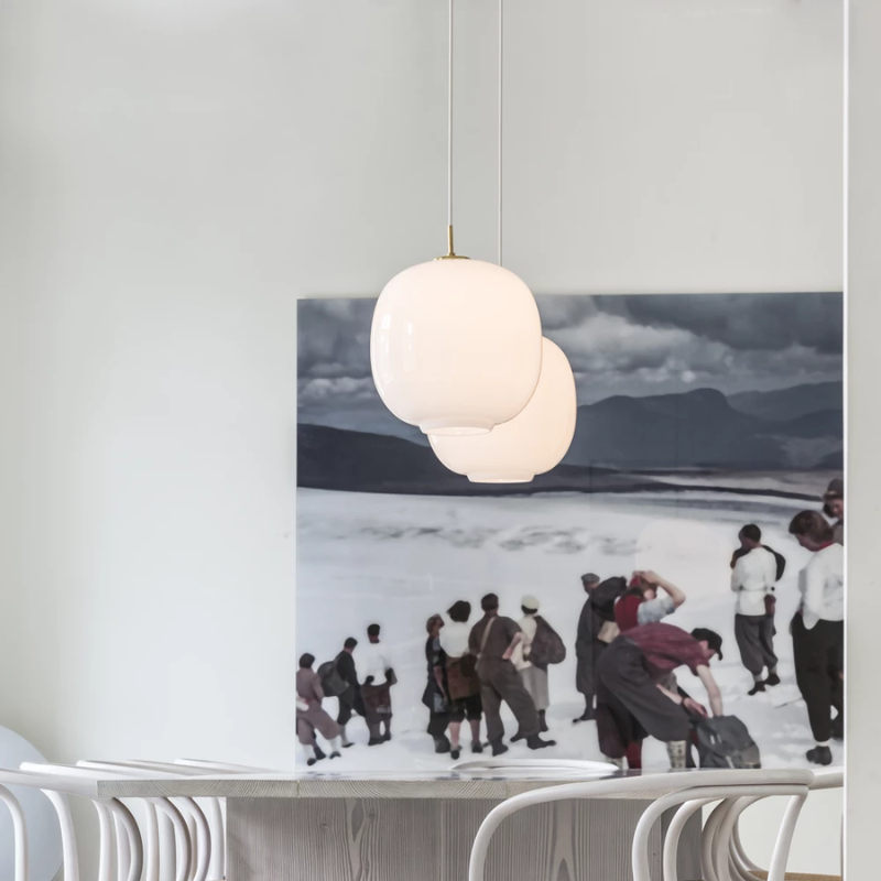 The VL 45 Radiohus Pendant from Louis Poulsen with white opal glass in a studio.