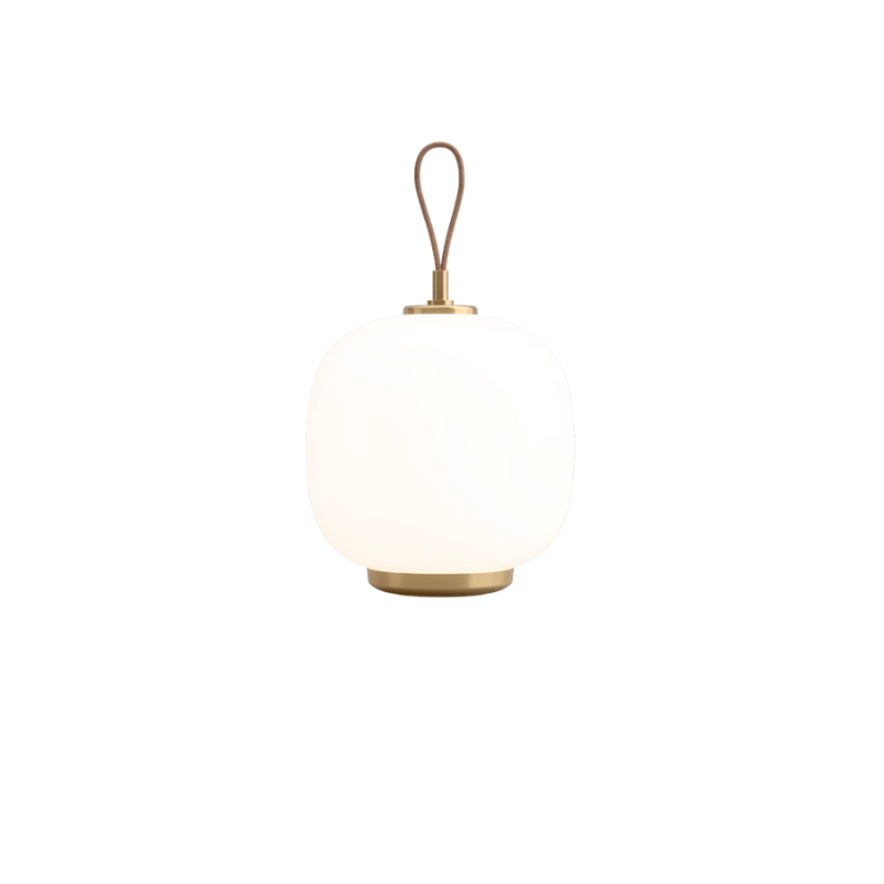 The VL 45 Radiohus Portable Lamp from Louis Poulsen in opal white glass turned on.