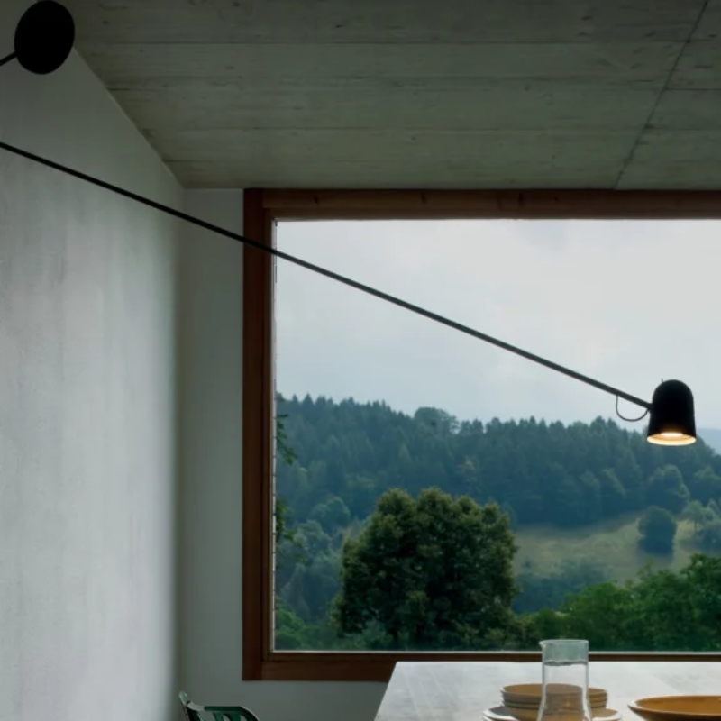 The Counterbalance Wall Sconce from Luceplan in a family area.