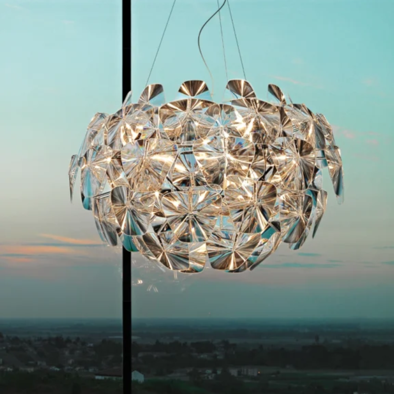 The Hope Chandelier from Luceplan in a primary bedroom. all-groups