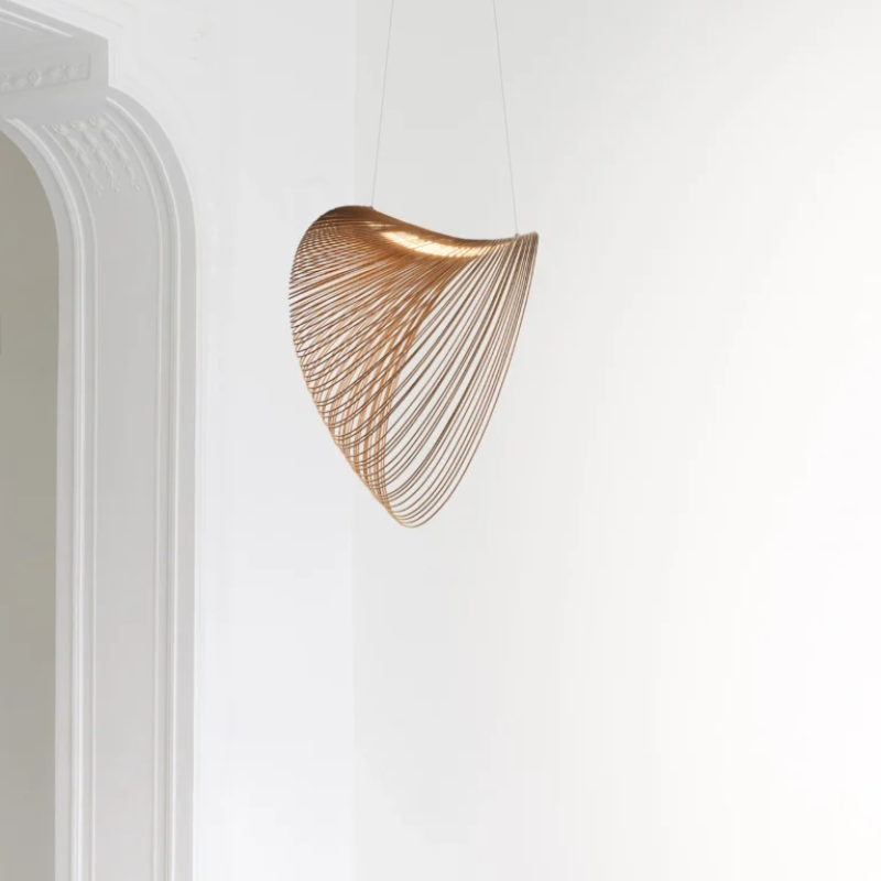 The Illan Chandelier from Luceplan in a primary bedroom. all-groups