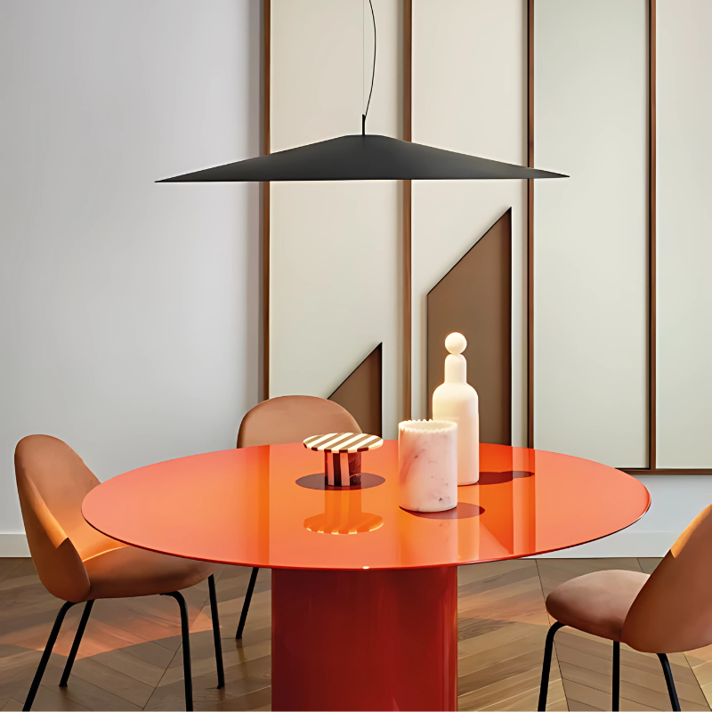 The Koinè Pendant from Luceplan in black in a family area.