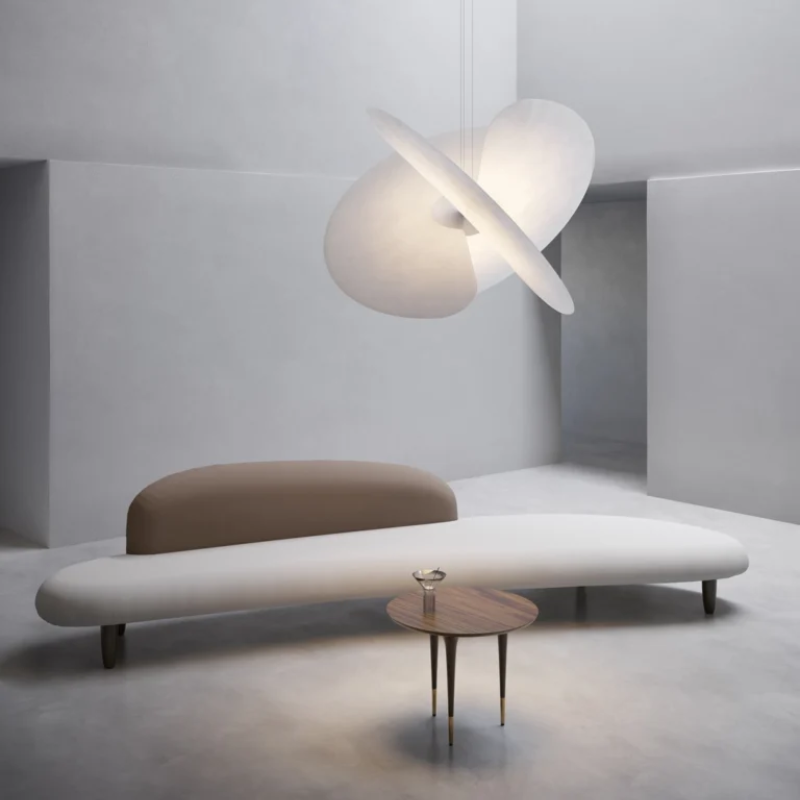 The Levante Chandelier from Luceplan in a living room.