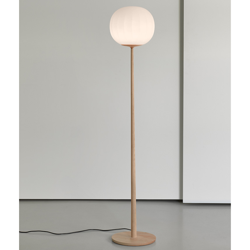 The Lita Floor Lamp from Luceplan in solid ash wood in a living room.