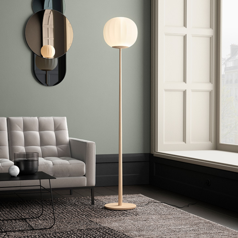 The Lita Floor Lamp from Luceplan in solid ash wood in a lounge.