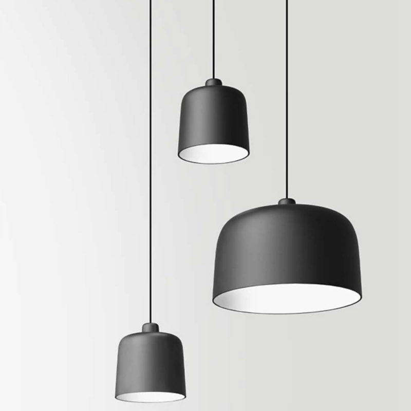 The Zile Pendant from Luceplan in matte black in a living room.