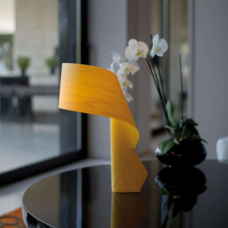 The Air Table from LZF lamps in yellow in a living room.