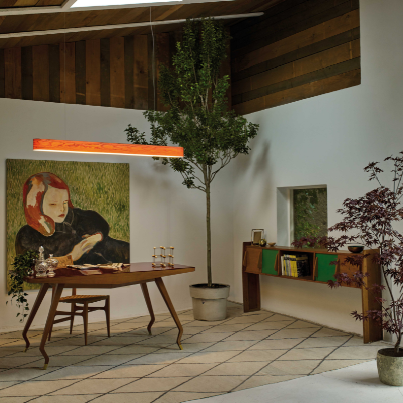 The I-Club Slim Suspension from LZF lamps with the natural cherry veneer in a family room.