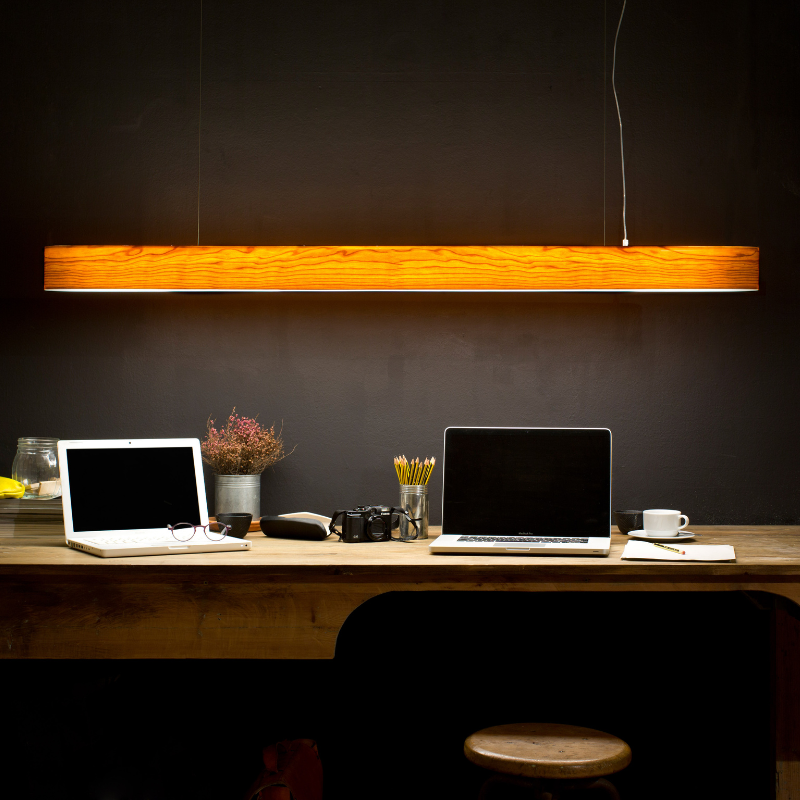 The I-Club Slim Suspension from LZF lamps with the natural cherry veneer in a home office.