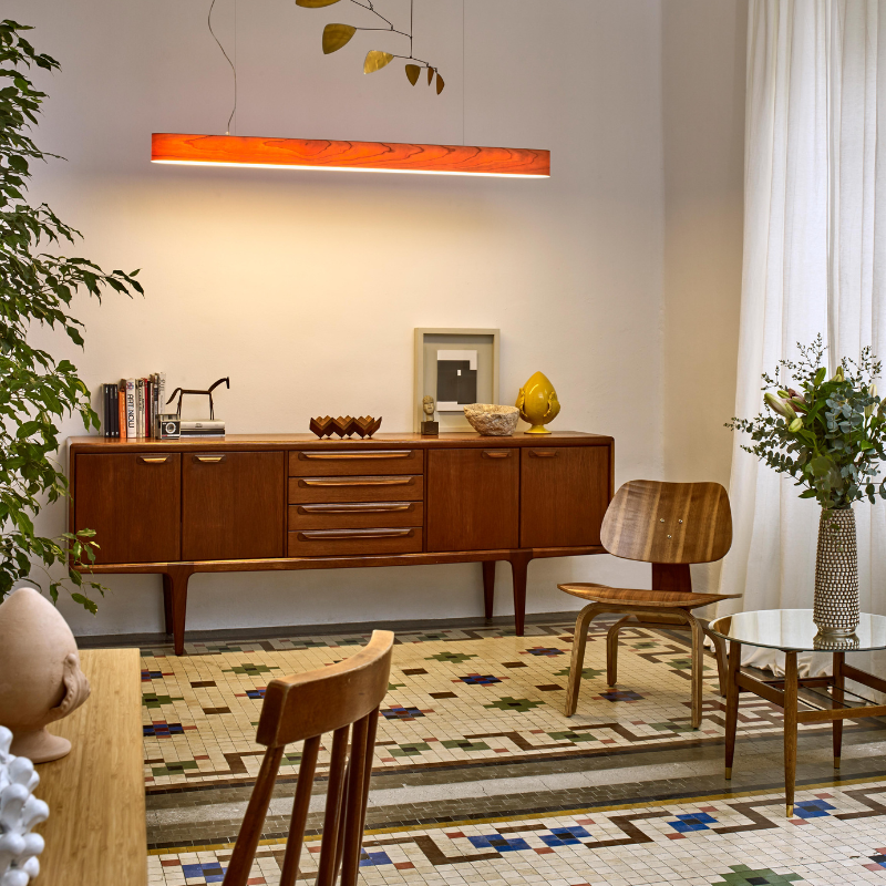 The I-Club Slim Suspension from LZF lamps with the natural cherry veneer in a living room.