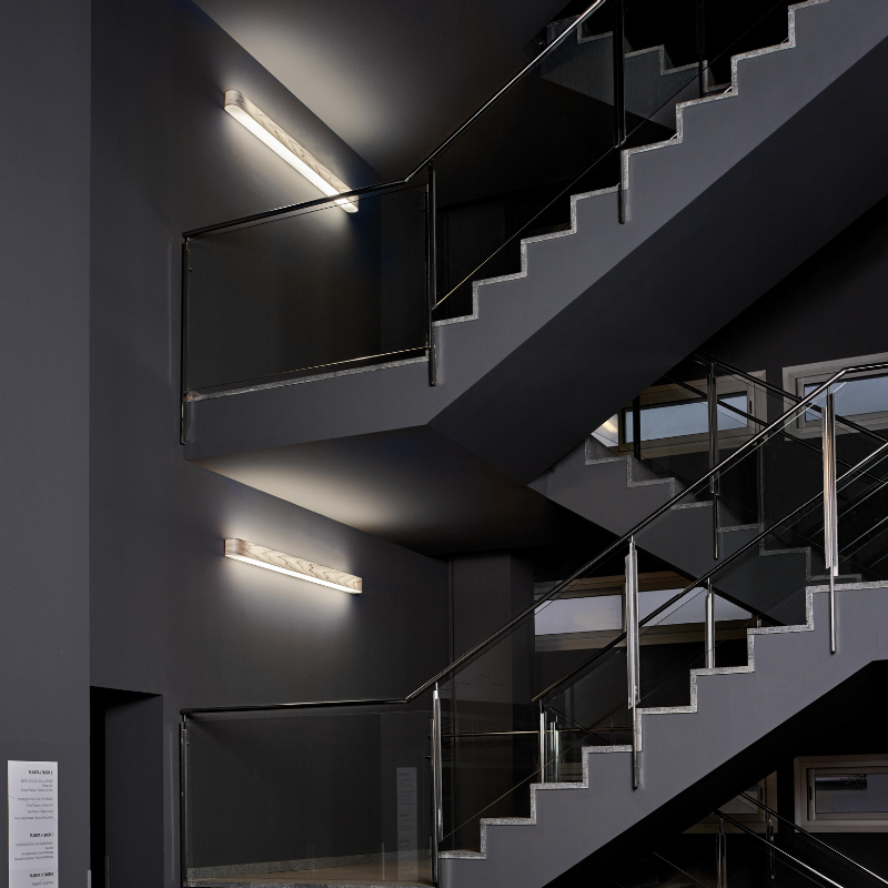 The I-Club Slim Wall from LZF Lamps in grey veneer in a commercial space.