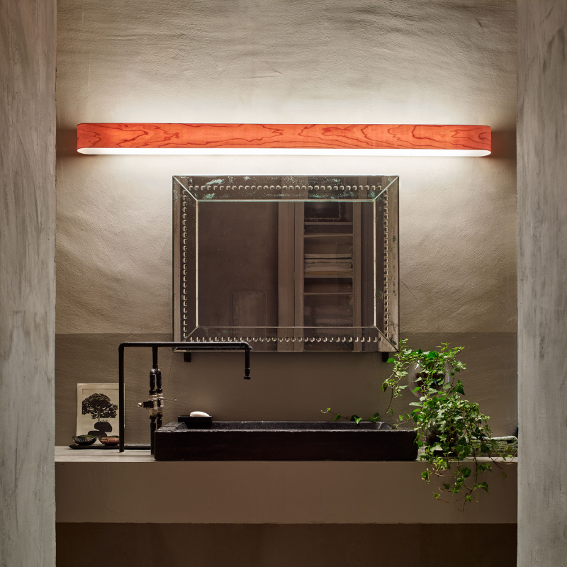 The I-Club Slim Wall from LZF Lamps with natural cherry veneer in a bathroom.