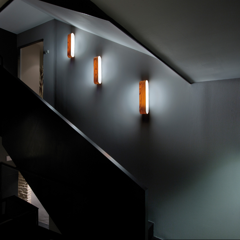 The I-Club Small Wall from LZF lamps with natural cherry veneer in a family room.