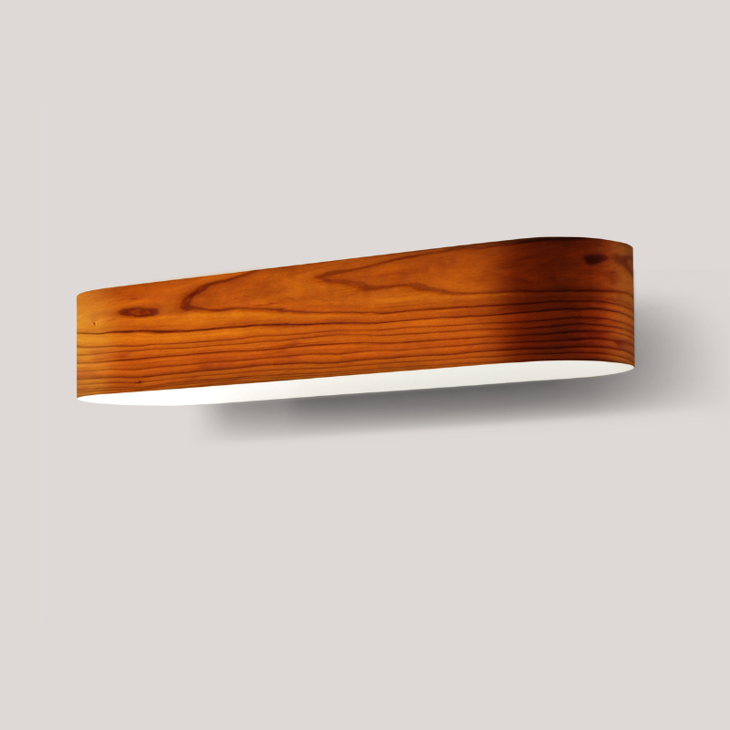 The I-Club Small Wall from LZF lamps with natural cherry veneer in a studio.