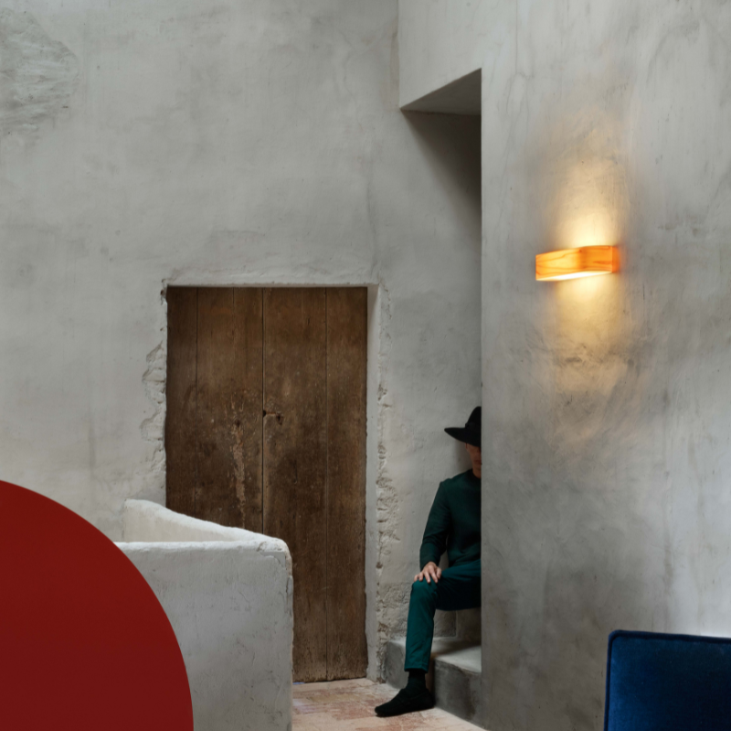 The I-Club Small Wall from LZF lamps with yellow veneer in a living space.