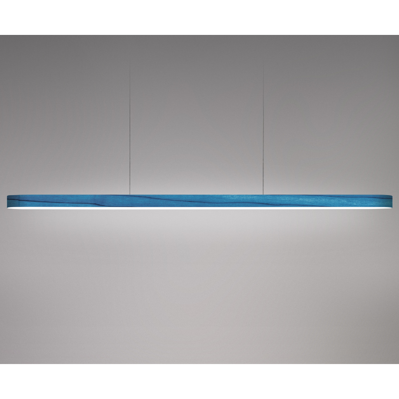 The Long I-Line Suspension from LZF lamps with the blue veneer in a studio.