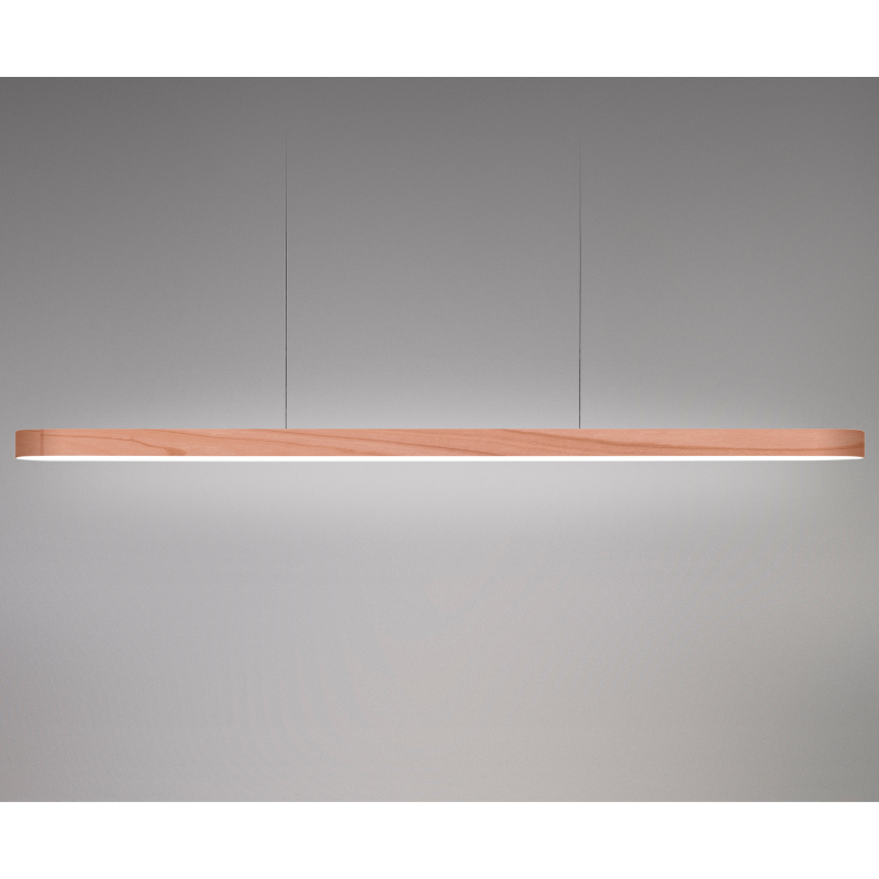 The Long I-Line Suspension from LZF lamps with the pale rose veneer in a studio.