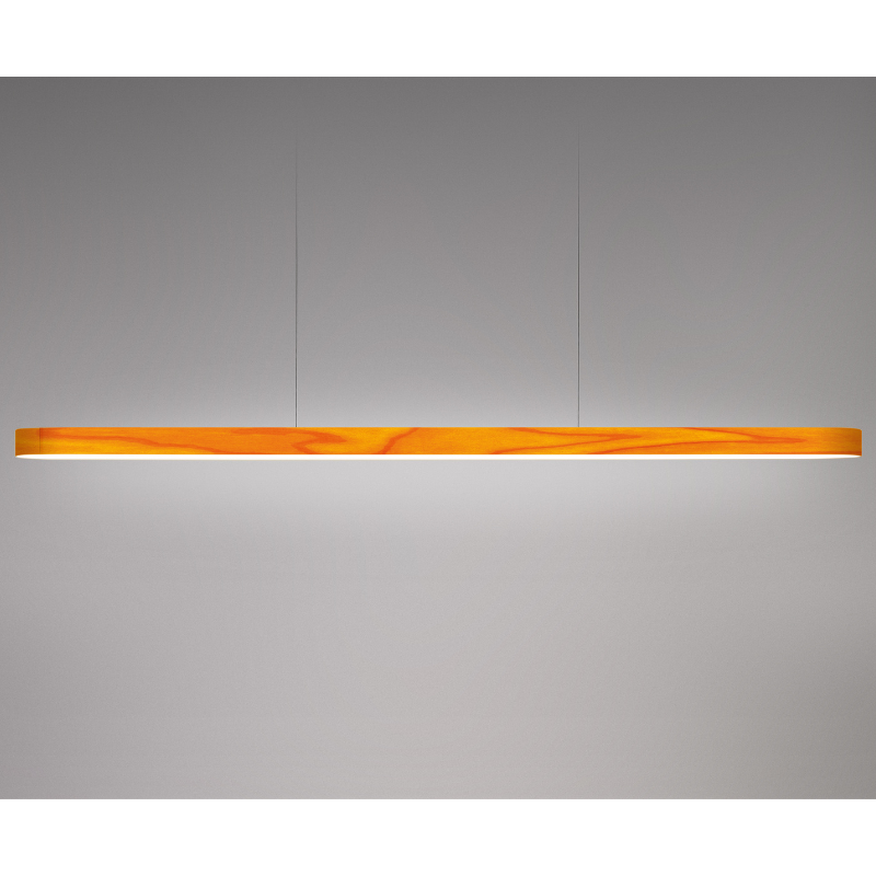 The Long I-Line Suspension from LZF lamps with the yellow veneer in a studio.